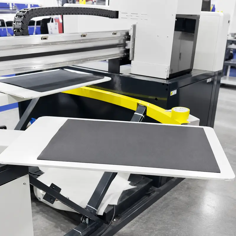 Garment loading onto the compact 6-station rotary carousel platen
