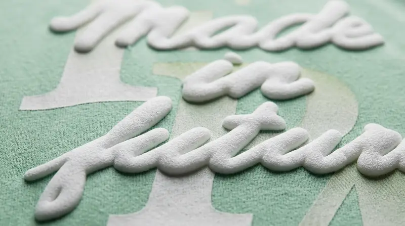 Textured puff printing and distress crackle effect paste on garment